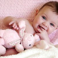 baby girl with toy bunny rabbit.